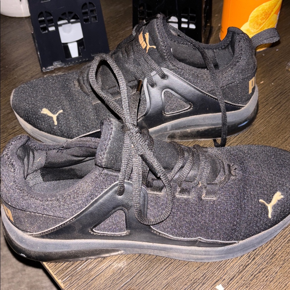 Puma Black Sneakers with Gold Highlights